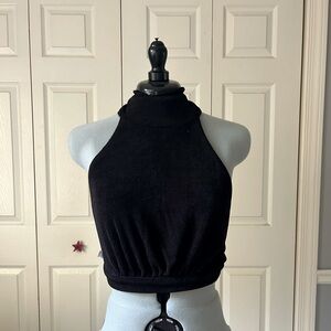 High neck stretchy black halter that buttons at the neck and ties at the waist